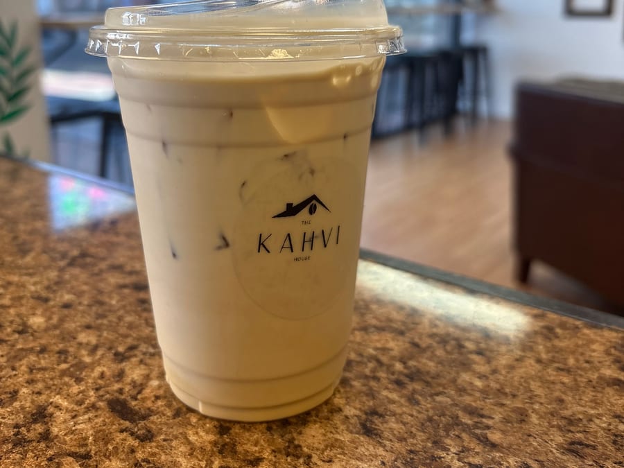 Americano Blanco — iced espresso with macadamia nut and white chocolate, in a Kahvi House cup